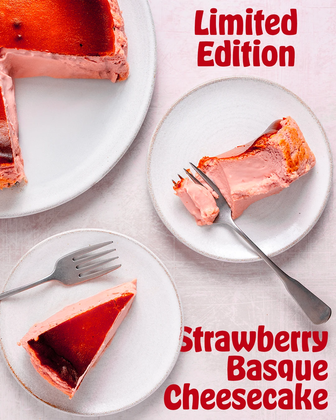 Two plates of strawberry Basque cheesecake shot from above
